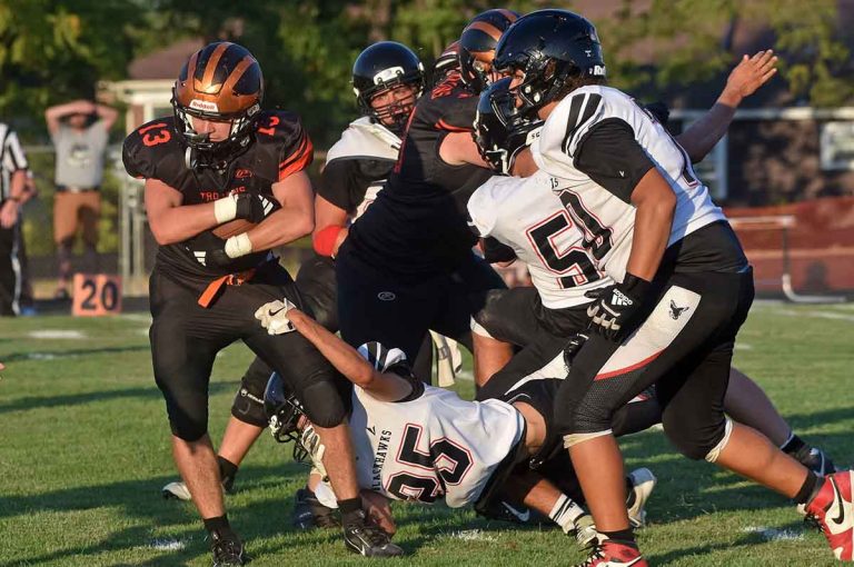 Arcanum prevails in home opener