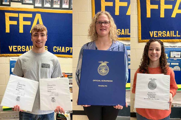 Three Versailles FFA Officers receive gold rated office books